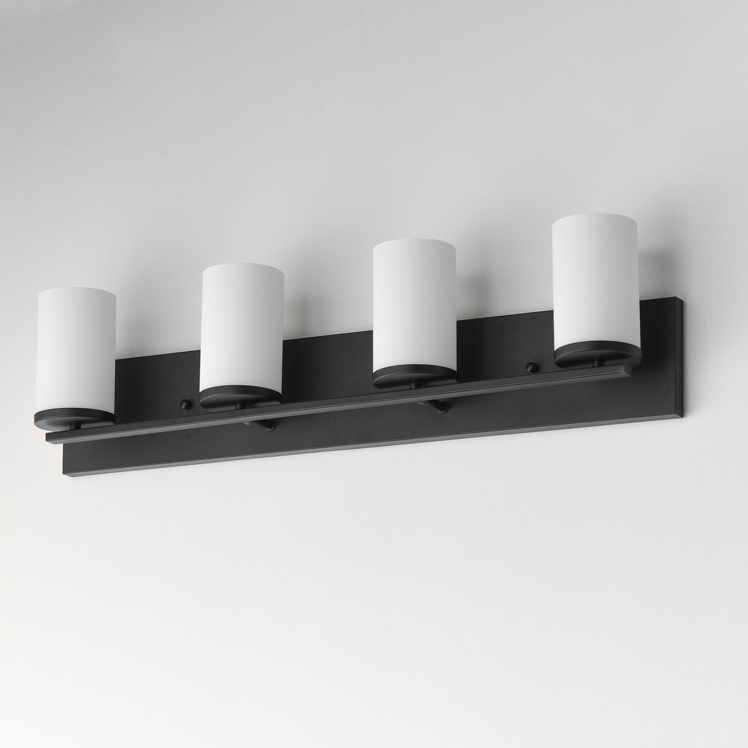 Maxim - 10284SWBK - Four Light Bath Vanity - Lateral - Black
