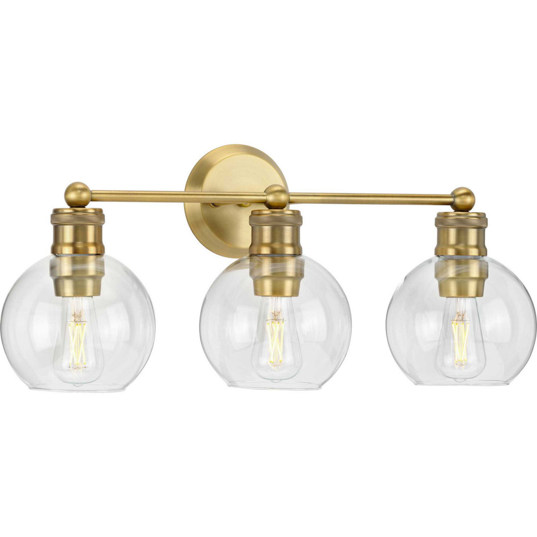 Hansford Three Light Bath Bracket in Vintage Brass - available from The Lighting Shoppe, trusted by Canadian homeowners