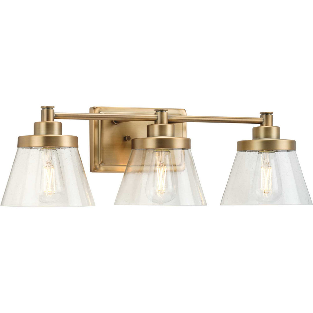Hinton Three Light Bath Bracket in Vintage Brass - available from The Lighting Shoppe, trusted by Canadian homeowners
