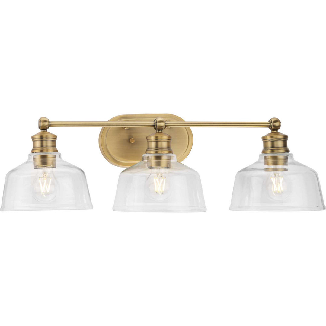 Singleton Three Light Bath in Vintage Brass - available from The Lighting Shoppe, trusted by Canadian homeowners
