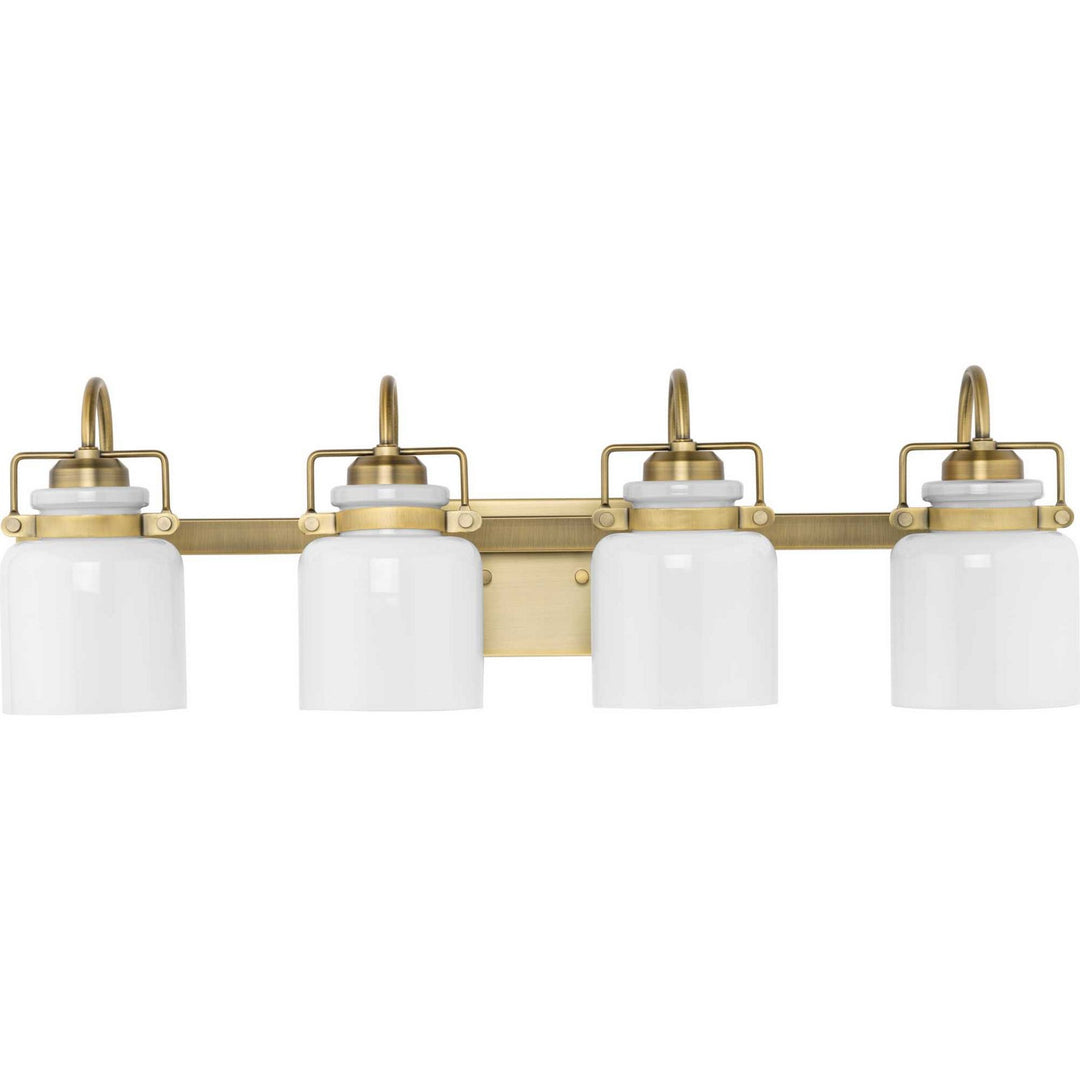Fessler Four Light Bath in Vintage Brass - available from The Lighting Shoppe, trusted by Canadian homeowners