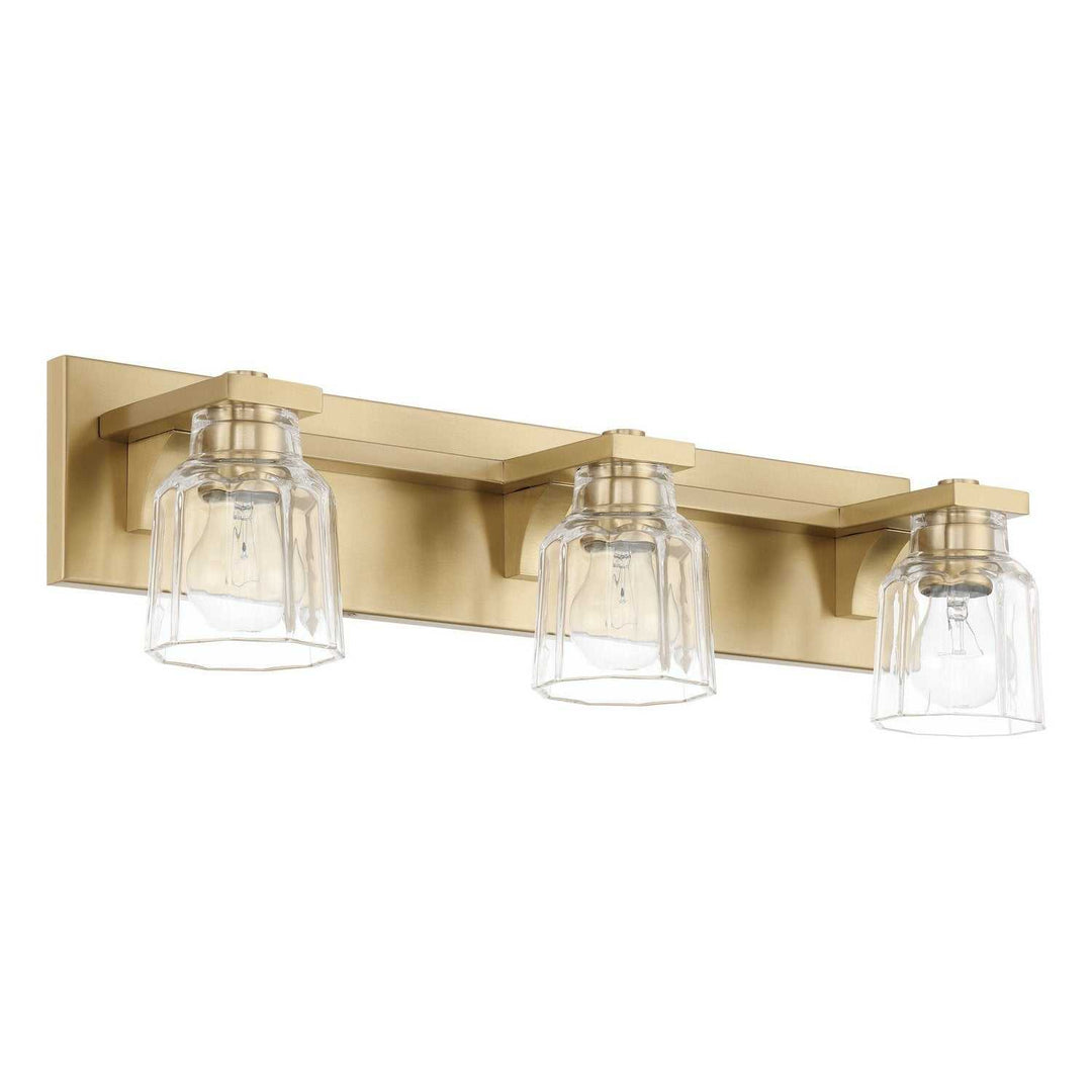 Dryden Three Light Vanity in Champagne Gold Thesis Canada