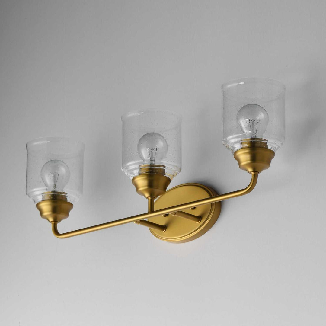 Maxim - 12263CDNAB - Three Light Bath Vanity - Acadia - Natural Aged Brass
