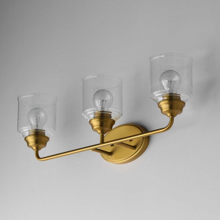 Maxim - 12263CDNAB - Three Light Bath Vanity - Acadia - Natural Aged Brass